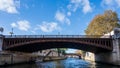 Petit Pont Cardinal Lustiger is an old arch bridge crossing the River Seine Paris France Royalty Free Stock Photo