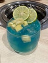 Boozy Blue Hawaii Cocktail with Pineapple and lime.