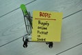 BOPIS - Buying Online Pickup In Store write on sticky notes isolated on Wooden Table