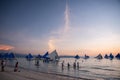 Boracay Island, Aklan, Philippines - Visitors enjoy sunset in a traditional Paraw boat powered by wind at Sunset. Circa January Royalty Free Stock Photo