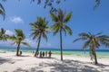 Boracay, Malay, Aklan, Philippines - Tourists admire the coast in White Beach, one of the most popular destinations in