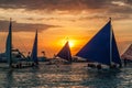 BORACAY, PHILIPPINES - FEBRUARY 1, 2018: Sunset behind Bangkas (paraw), double-outrigger boats, Boracay island