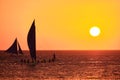 Boracay, Philippines - Jan 23, 2020: Sunset on Boracay island. Sailing and other traditional boats with tourists on the Royalty Free Stock Photo