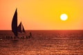 Boracay, Philippines - Jan 23, 2020: Sunset on Boracay island. Sailing and other traditional boats with tourists on the Royalty Free Stock Photo