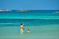 Boracay, Philippines - Jan 30, 2020: White beach of Boracay island. A guy and a girl take photos of themselves in the