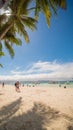 BORACAY, PHILIPPINES - JANUARY 7, 2018 - Tourists relaxing on the paradise shore of the White Beach in Boracay Royalty Free Stock Photo