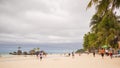 BORACAY, PHILIPPINES - JANUARY 7, 2018 - Tourists relaxing on the paradise shore of the White Beach in Boracay Royalty Free Stock Photo