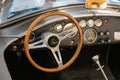 AC Cobra logo brand and text sign steering wheels of sport car interior of vintage old