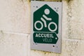 Accueil velo logo and sign text of french bike cycle bikers welcome sign in shop
