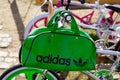 Adidas logo sign and brand text on old ancient green sport bag retro on bmx bicycle