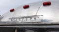 Airstream logo text and sign text on vintage aluminum camper trailer travel