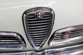 Alfa romeo logo brand and text sign front of sport sixties vintage car