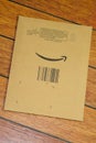 Amazon logo sign arrow smiling printed on single envelope brown cardboard box side