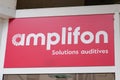 Amplifon sign text and logo brand facade shop hearing aid store agency