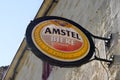 Amstel dutch beer sign round text and logo brand front of restaurant bar pub