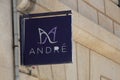 Andre logo brand facade and sign text wall of shoes store French apparel footwear
