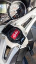 Aprilia scooter logo text and brand sign front dashboard speedometer detail motorcycle