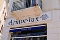 Armor Lux brand logo and sign facade wall text French clothes store marine boat ocean