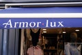 Armor Lux sign text store wall and logo brand shop windows entrance facade boutique