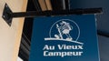 au vieux campeur sign text and brand logo facade wall storefront building in town