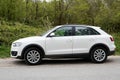 Audi Q3 german suv car white in profile side view in street Royalty Free Stock Photo