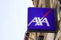 Axa logo brand and text sign front of agency French multinational insurance office