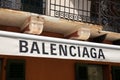 Balenciaga sign text and logo brand on wall facade entrance on luxury fashion clothes