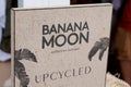 Banana moon upcycled sign brand and text logo on facade French shop chain for women