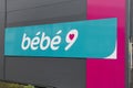 Bebe 9 sign text and logo brand front of shop for babies and toddlers kids store