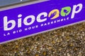 Biocoop logo brand and text sign on store front biological shop distribution of food