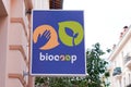 Biocoop logo brand and text sign on wall facade store front biological shop