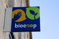 Biocoop logo sign and brand text on wall entrance facade bio store supermarket