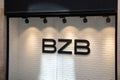 Bizzbee bzb shop sign text and brand logo on facade shop and entrance windows store