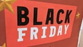 Black friday text sign on red stickers on store windows entrance for discount price