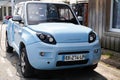 Bluesummer logo text and sign brand on EV Electric car with E-Mehari model from