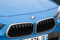 BMW logo brand and text sign on modern front blue german car hood face Royalty Free Stock Photo