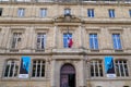 Bordeaux University facade historical building ancient Entrance with blue logo flag