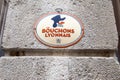 Bouchons Lyonnais restaurant logo text and brand sign wall facade