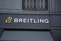 Breitling logo brand facade and text chain entrance sign swiss watches wall shop