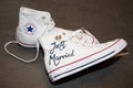 Bordeaux , Aquitaine / France - 11 07 2019 : Bride just married white Sneakers converse all star chuck taylor with wedding rings