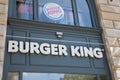 Burger King logo text and brand sign wall facade entrance restaurant us fast food