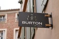 Burton of london logo brand clothing shop text sign on store front in the street