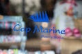 cap marine sign text and logo facade store clothing fashion shop brand