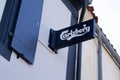 Carlsberg beer sign text and brand logo on facade bar pub restaurant