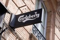 Carlsberg beer text and sign logo front of bar brand on wall restaurant pub