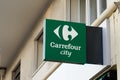 Carrefour city brand logo and text sign town store wall entrance shop supermarket