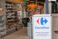 Carrefour supermarket sign text and logo front of panel in entrance market french brand
