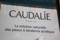 caudalie paris logo brand wall facade and sign text advertising of cosmetics shop spa Royalty Free Stock Photo