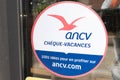 Cheque vacances ancv logo brand and text sign sticker on entrance door windows hotel