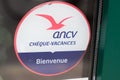 Cheque vacances label signage ancv logo brand and text sign sticker on facade entrance